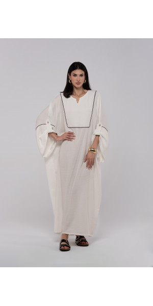 Long white linen kaftan with an elegant pattern Long white linen kaftan with an elegant pattern
